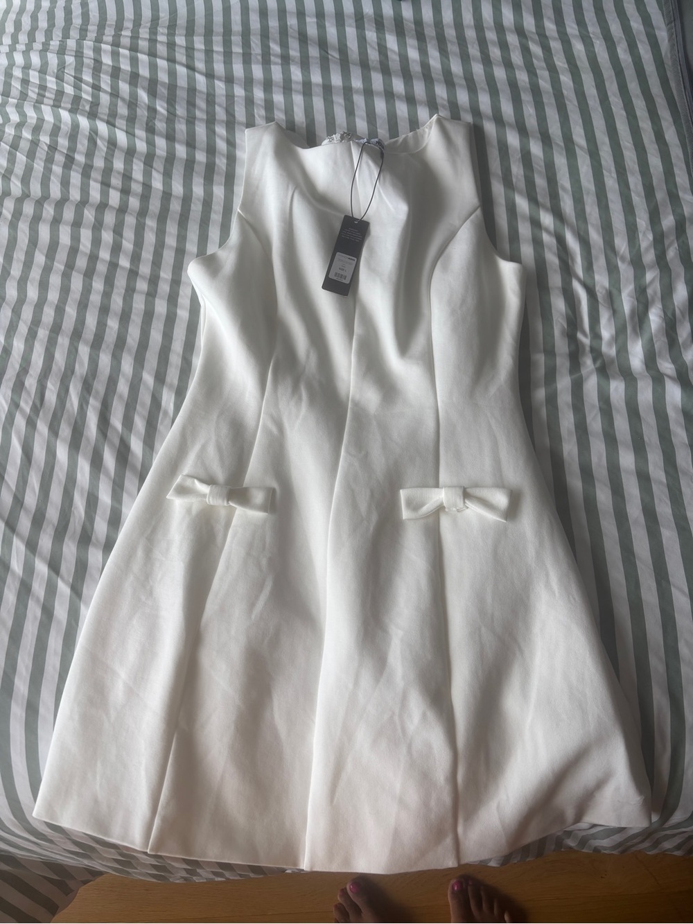 Fashion Nova White Sleeveless Mini Dress with Bow Pocket Detail